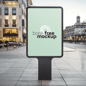 Blank vertical billboard mockup in an urban street setting.