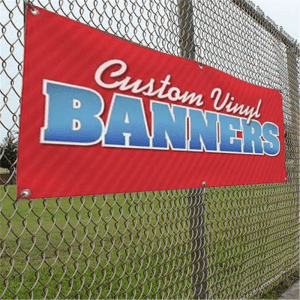 Large custom vinyl banner attached to chain-link fence.