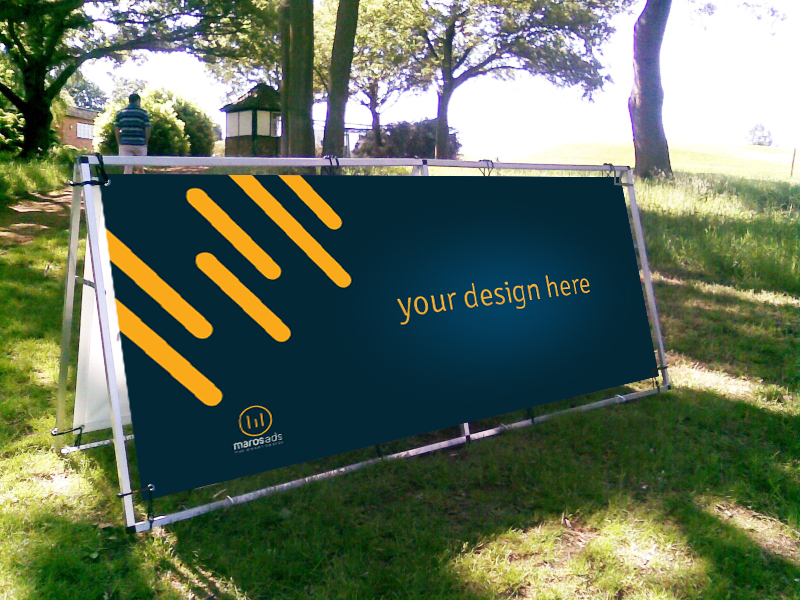 Outdoor banner with placeholder design in a park.