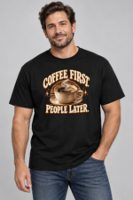 Model wearing black Coffee First People Later graphic T-shirt with brown and cream coffee artwork